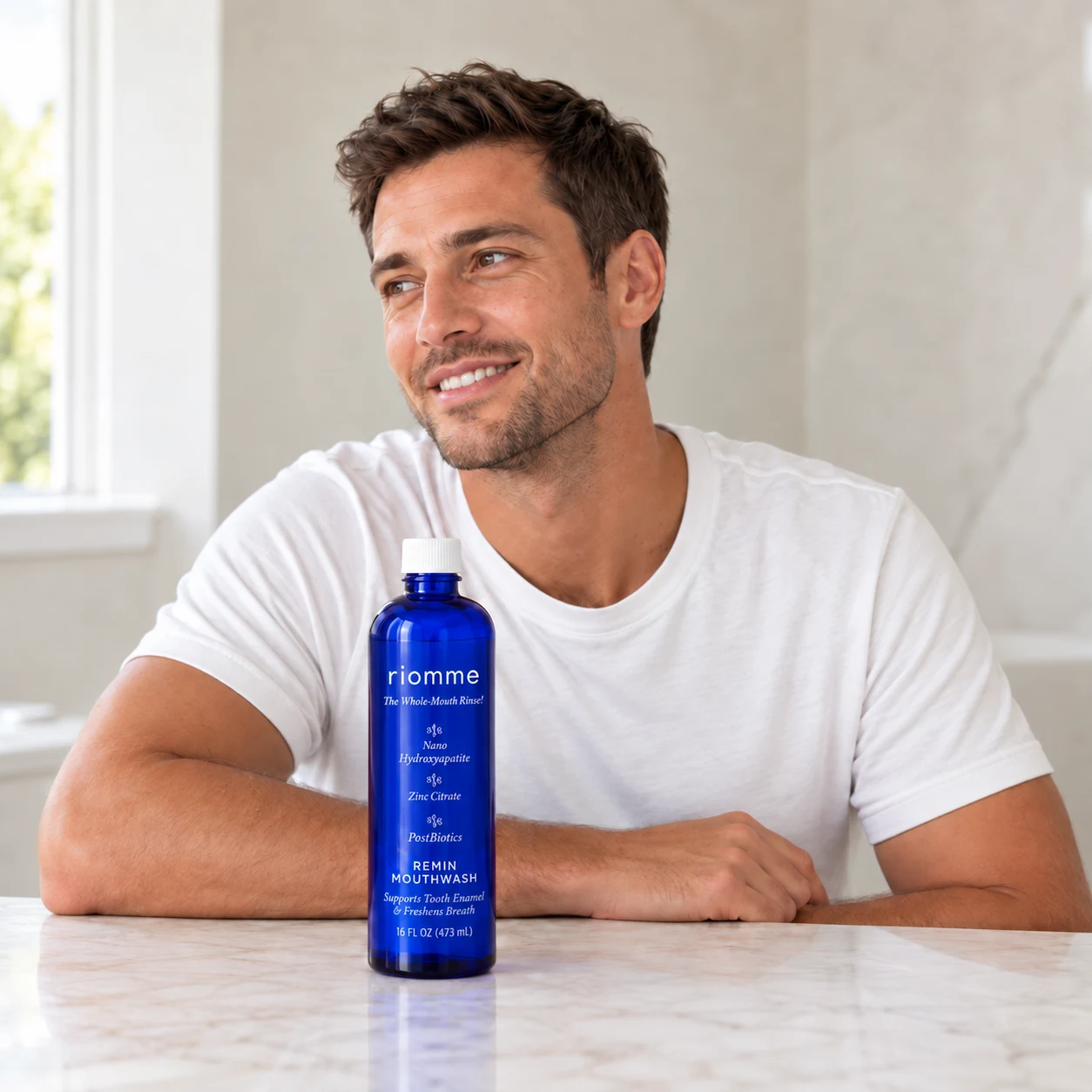 A man at a counter with Remin Mouthwash